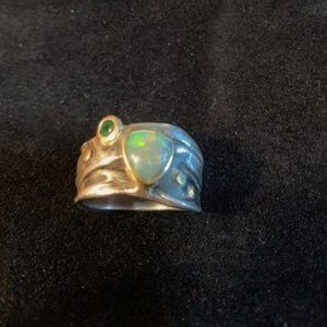 Womans opal and tsavorite green garnet ring. Sterling silver and gold accents.